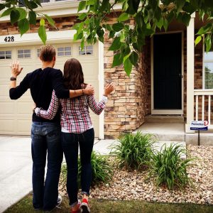 Photo of us waving goodbye to our perfect home to start a new life