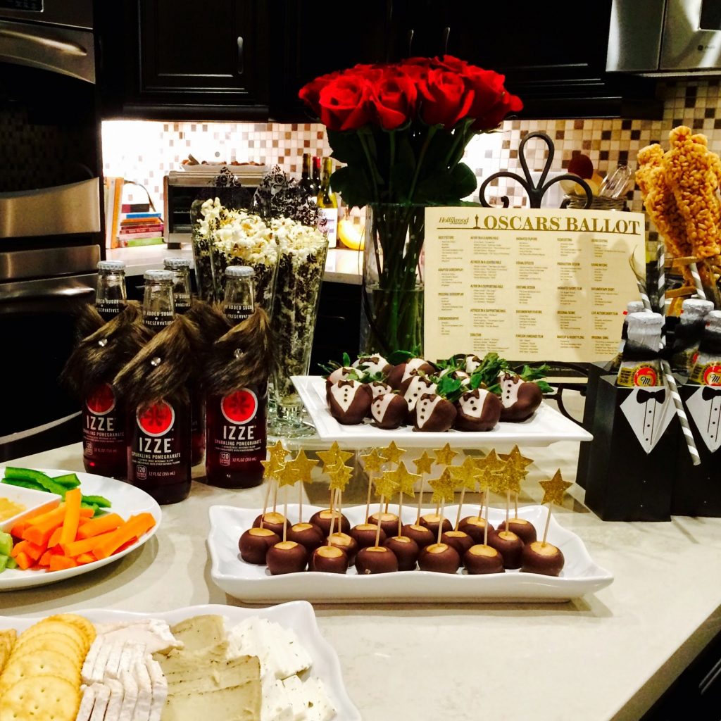 Photo of a buffet of food and drinks prepared for an Oscar themed party
